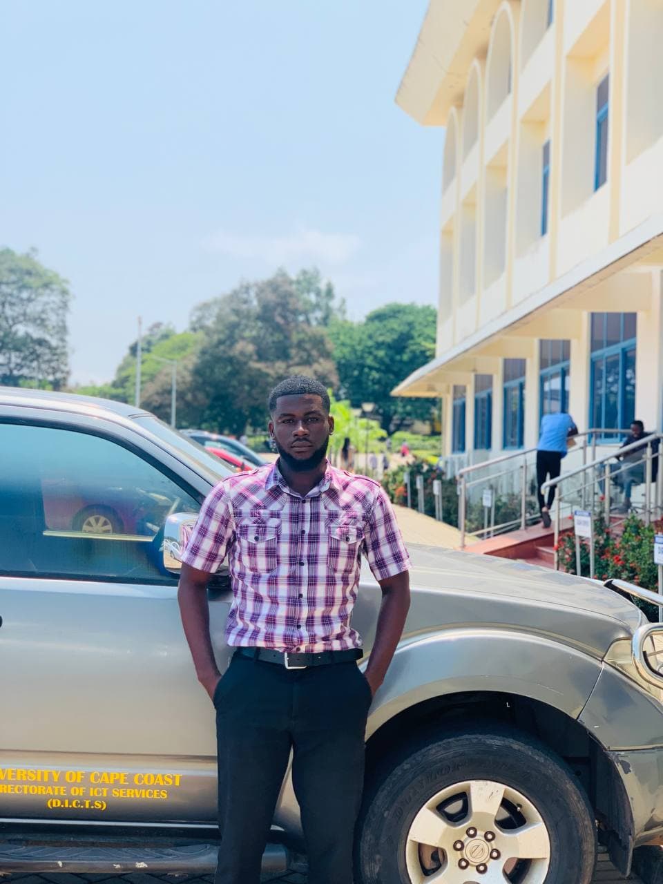 Daniel Carta standing outdoors at the University of Cape Coast